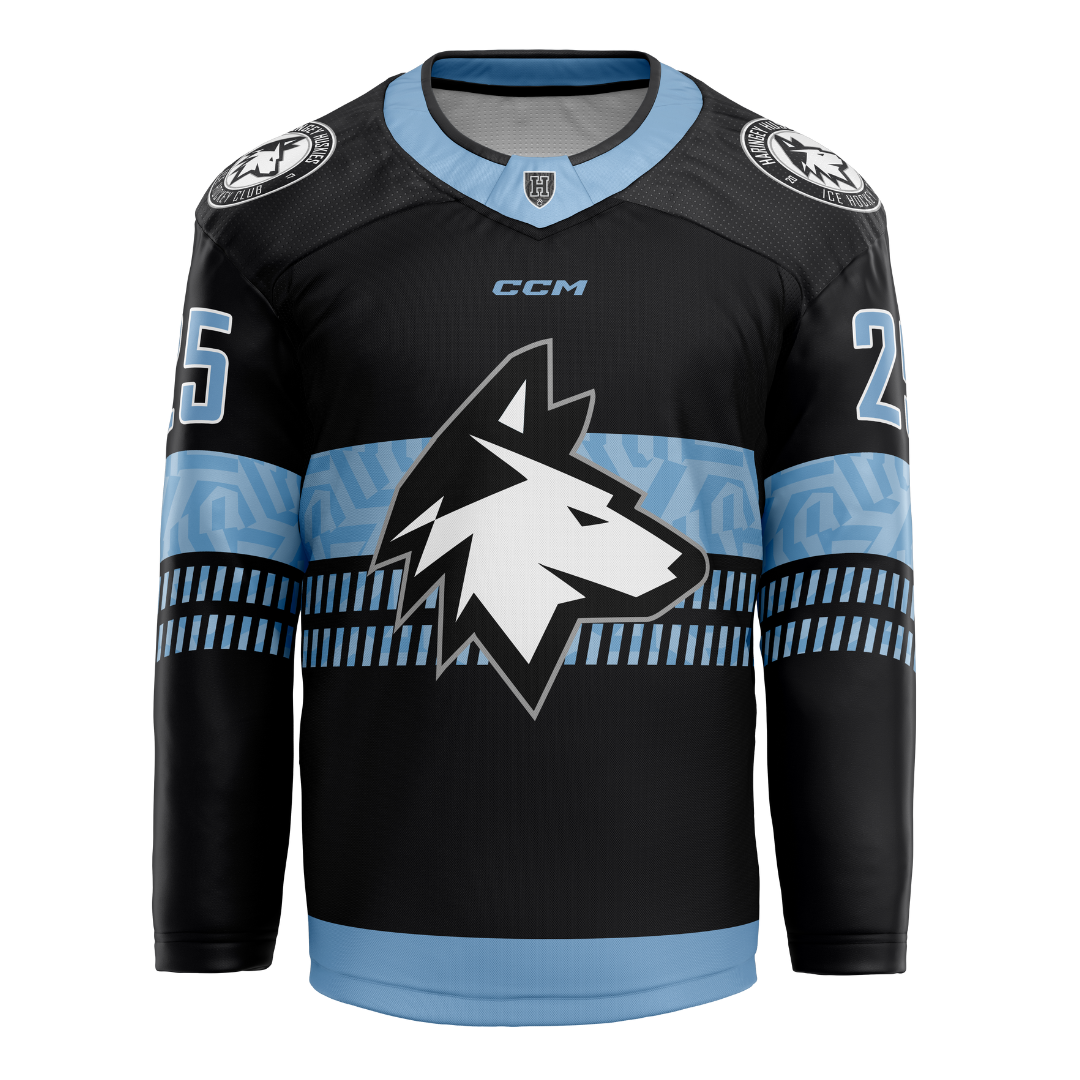 The Haringey Huskies 25/26 Away Jersey (NO NAME) from Haringey Huskies Store features black fabric with light blue and white accents, a stylized wolf head logo, number 25 on the sleeves, and bold geometric patterns on the chest and shoulders.