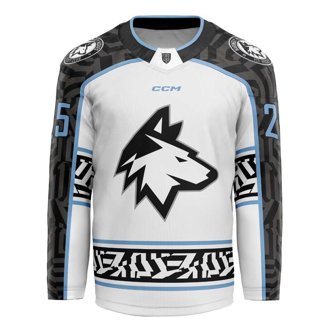The Haringey Huskies 25/26 Home Jersey (NO NAME) from Haringey Huskies Store features a white design with a central black wolf head, bold black geometric sleeve and waist patterns, blue accents, and number 25 on the sleeves—ideal for dedicated fans.