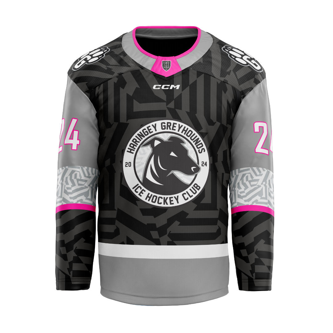 The Greyhounds 25/26 Dark Jersey (NAMED) from Haringey Huskies Store features black, grey, and pink colors, a dog logo, Haringey Greyhounds Ice Hockey Club design, geometric patterns, custom name/number option, and #24 on the sleeves.
